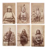 MITCHELL, Daniel S. (1838-1929), photographer. A group of 24 CDVs of Sioux chiefs and warriors at Red Cloud Agency. Cheyenne, WY, ca 1877.