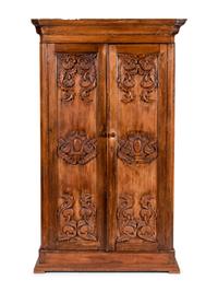 A Mexican Carved Walnut Wardrobe Cabinet
