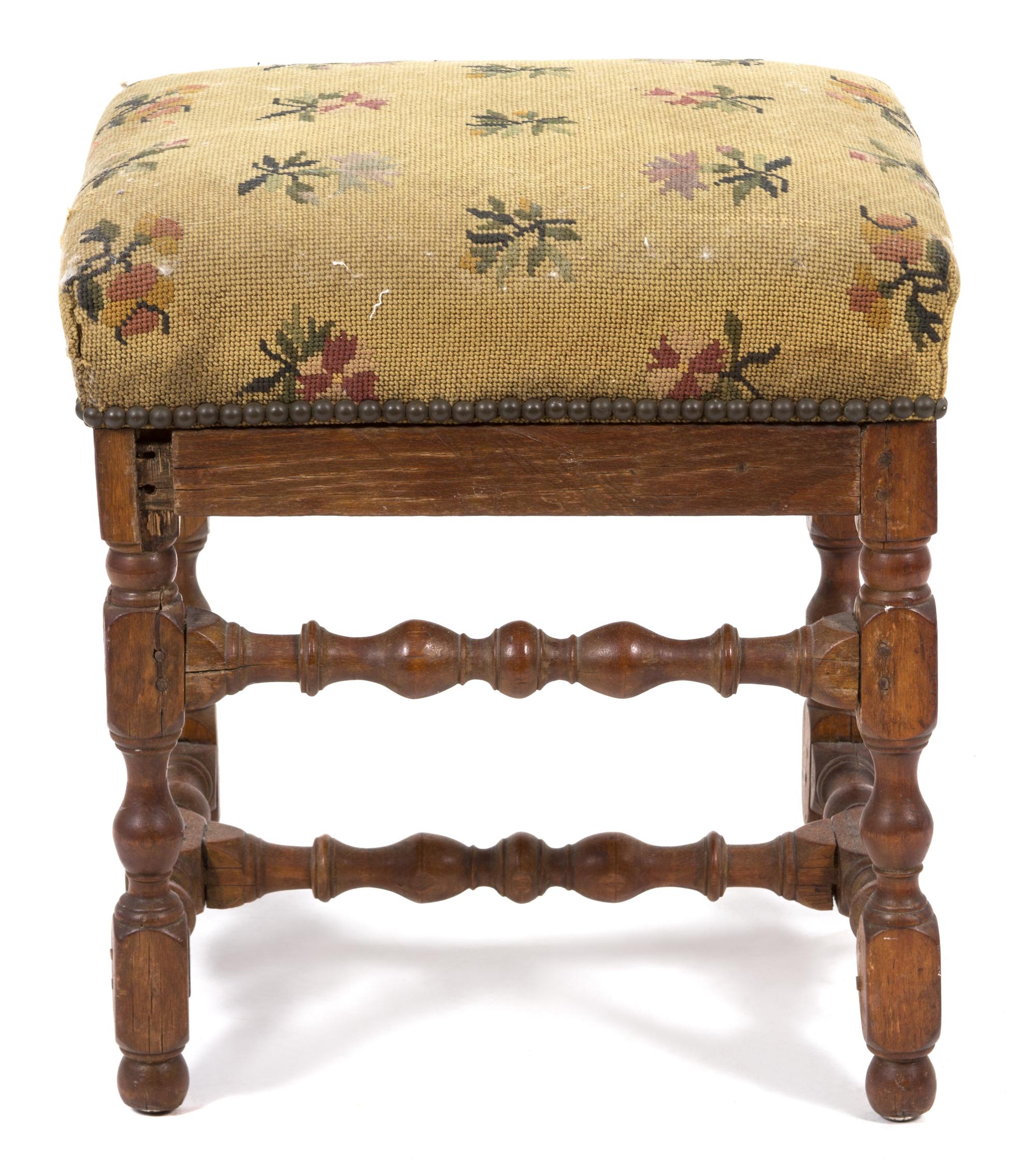 A Jacobean Style Footstool Height 18 x width 17 1/2 x depth 15 1/2 inches.