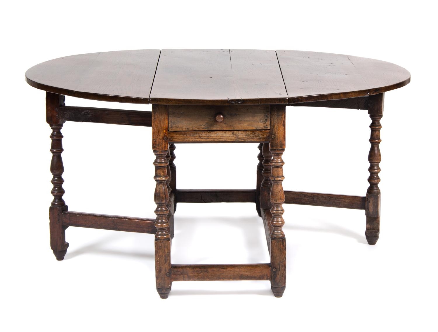 An English Oak Gate Leg Table Height 29 1/2 x width 52 x depth 21 inches (closed).