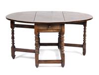 An English Oak Gate Leg Table Height 29 1/2 x width 52 x depth 21 inches (closed).