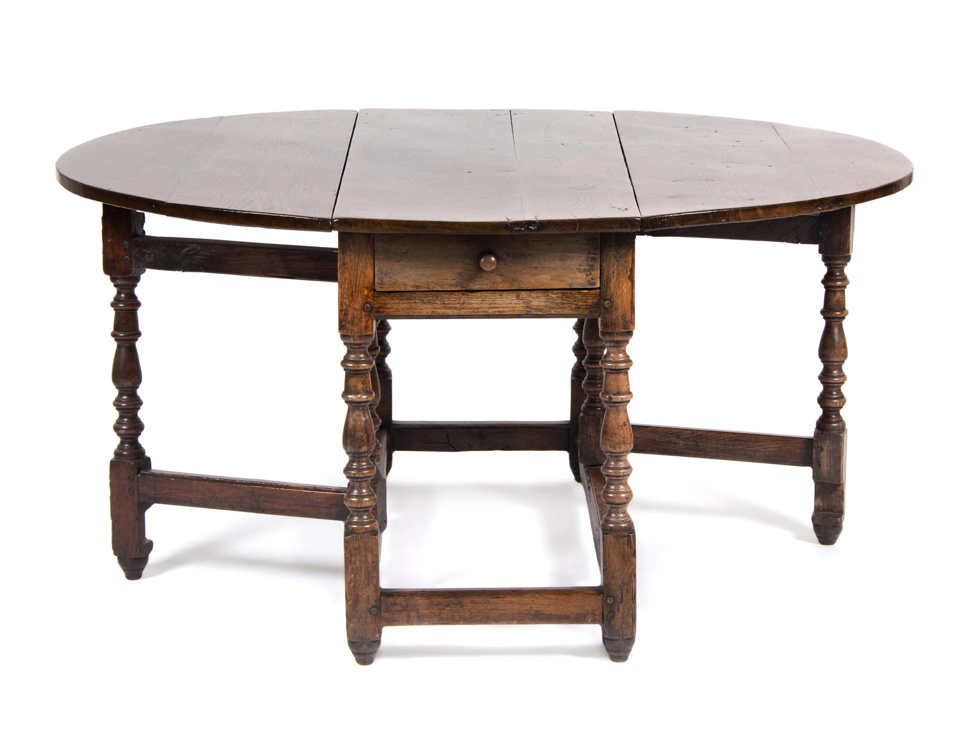 An English Oak Gate Leg Table Height 29 1/2 x width 52 x depth 21 inches (closed).
