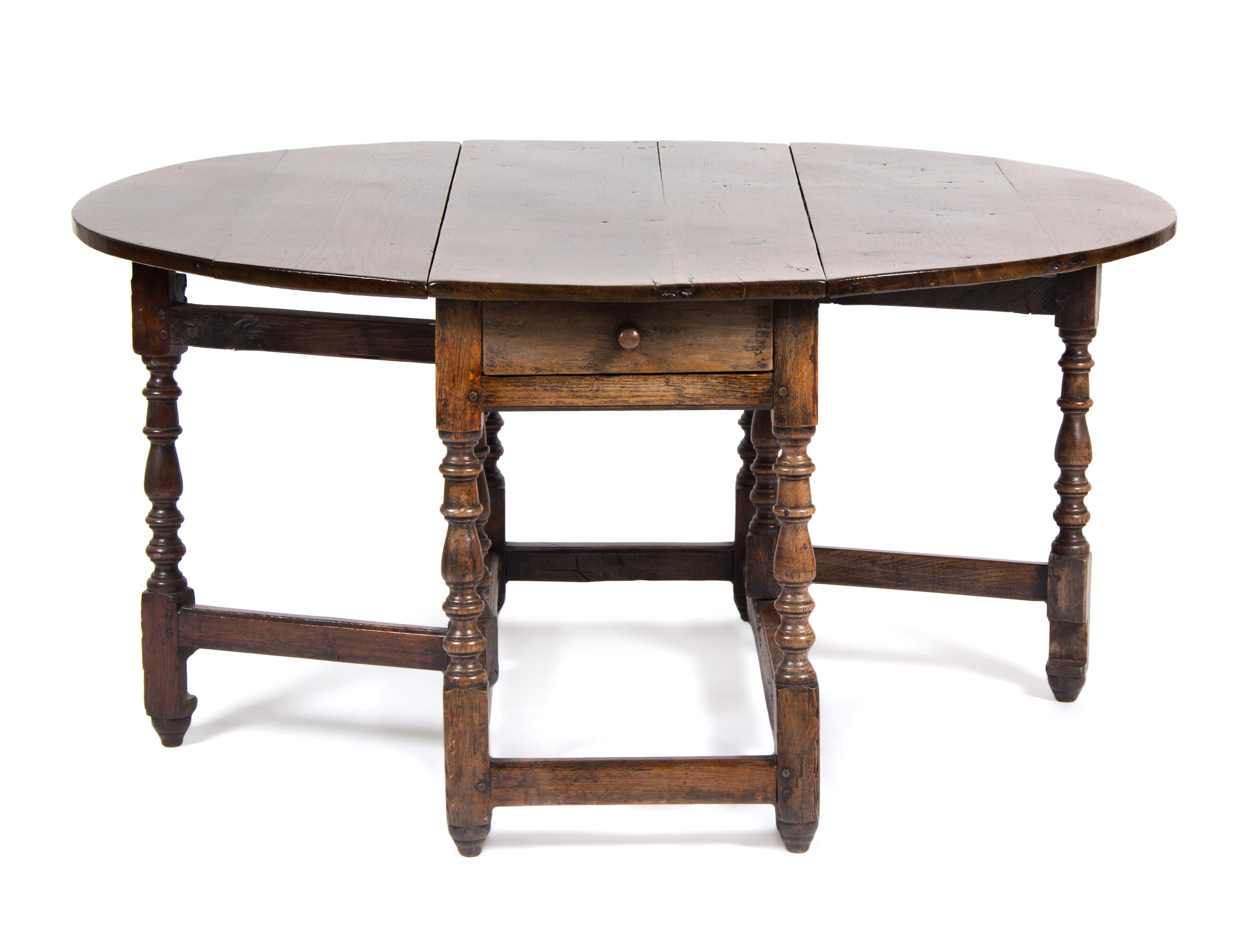 An English Oak Gate Leg Table Height 29 1/2 x width 52 x depth 21 inches (closed).