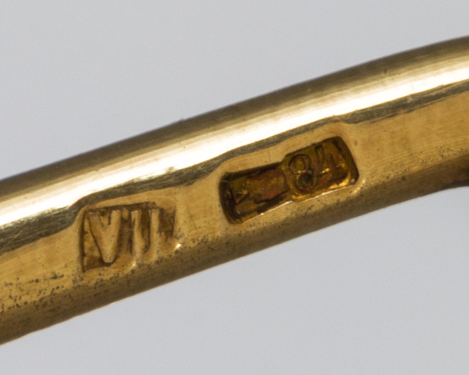 A Russian Silver-Gilt and Enamel Spoon, Mark of 11th Artel, Moscow, early 20th century, having a blue enameled finial, the underside of