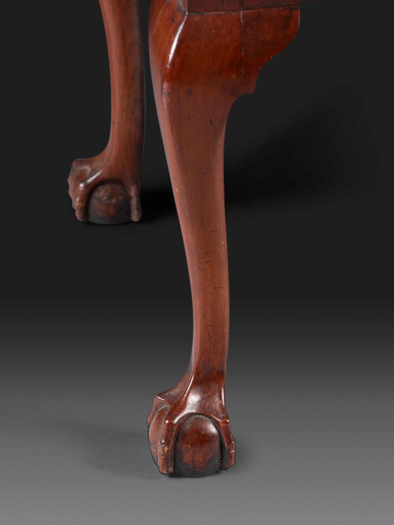 A Chippendale Fan-Carved Walnut Claw-and-Ball Foot Dressing Table