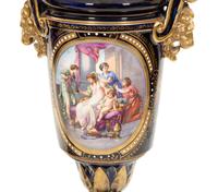 A Pair of Sèvres Style Porcelain Urns Mounted as Lamps