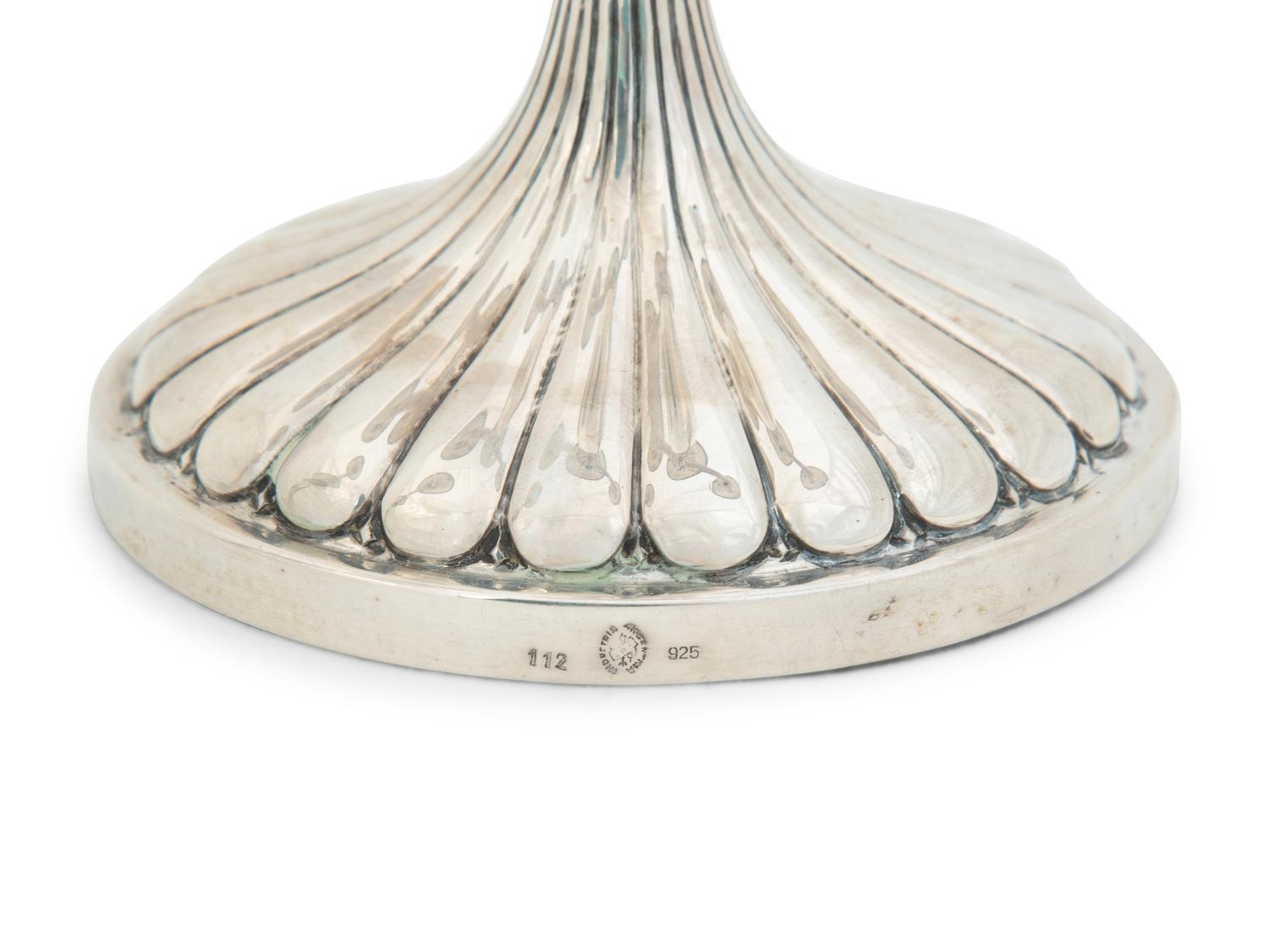A Pair of Argentine Weighted Silver Three-Light Candelabra