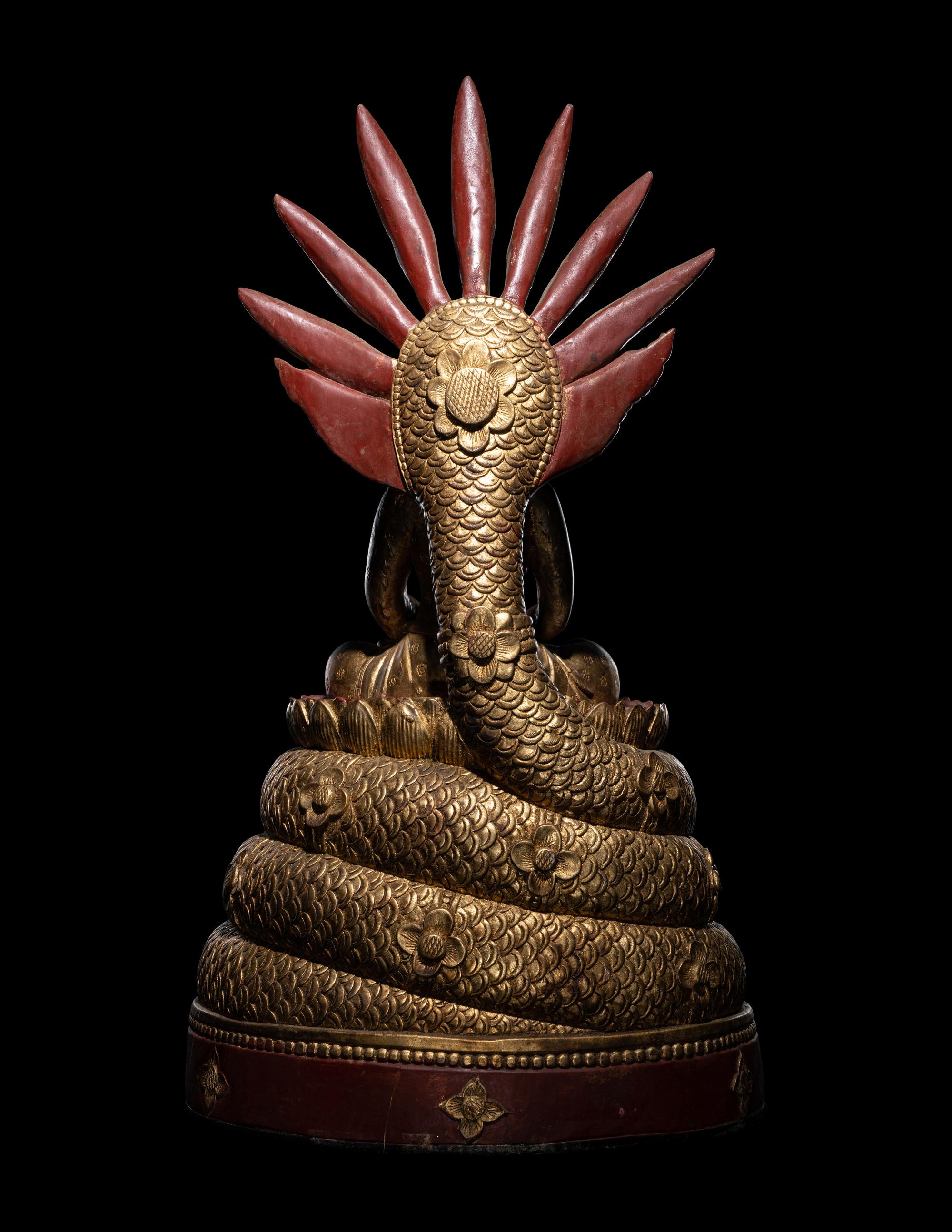 A Large Thait Gilt and Red Lacquered Wood Figure of Buddha