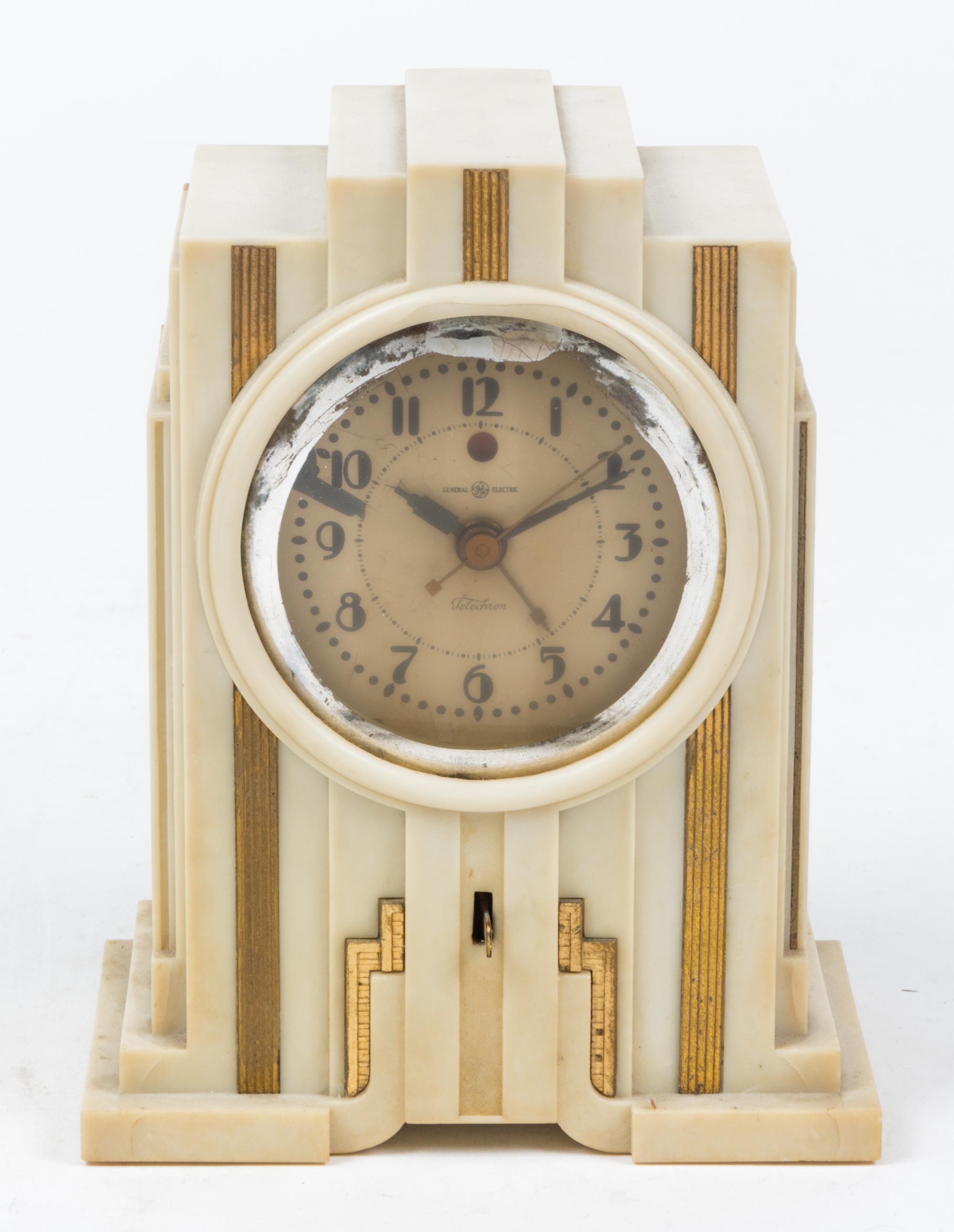 An Art Deco Composite Table Clock Height 7 1/2 inches. — FIRST HALF 20TH CENTURY