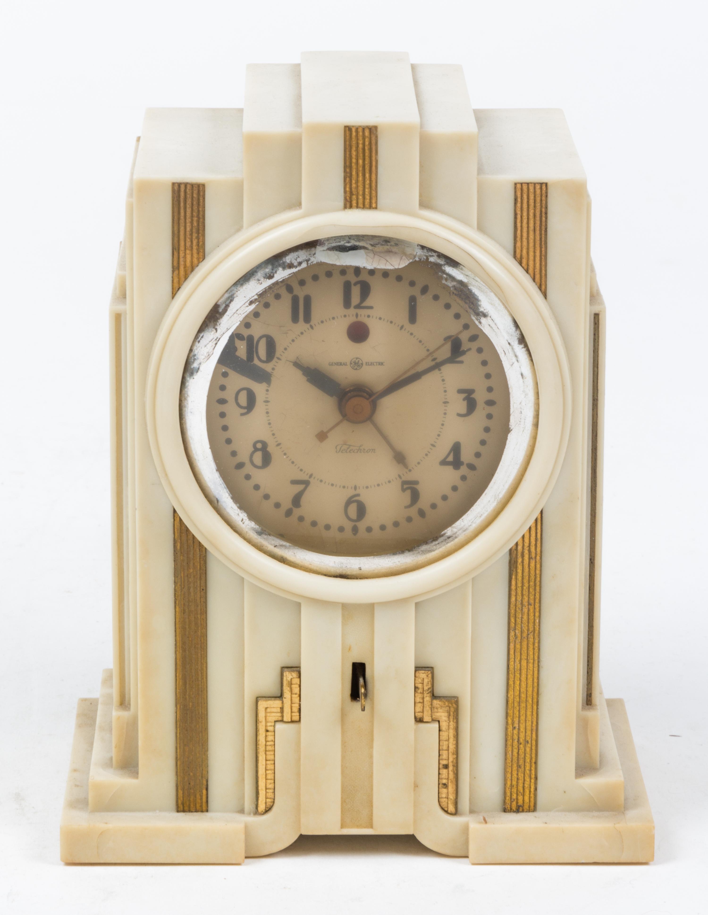 An Art Deco Composite Table Clock Height 7 1/2 inches. — FIRST HALF 20TH CENTURY