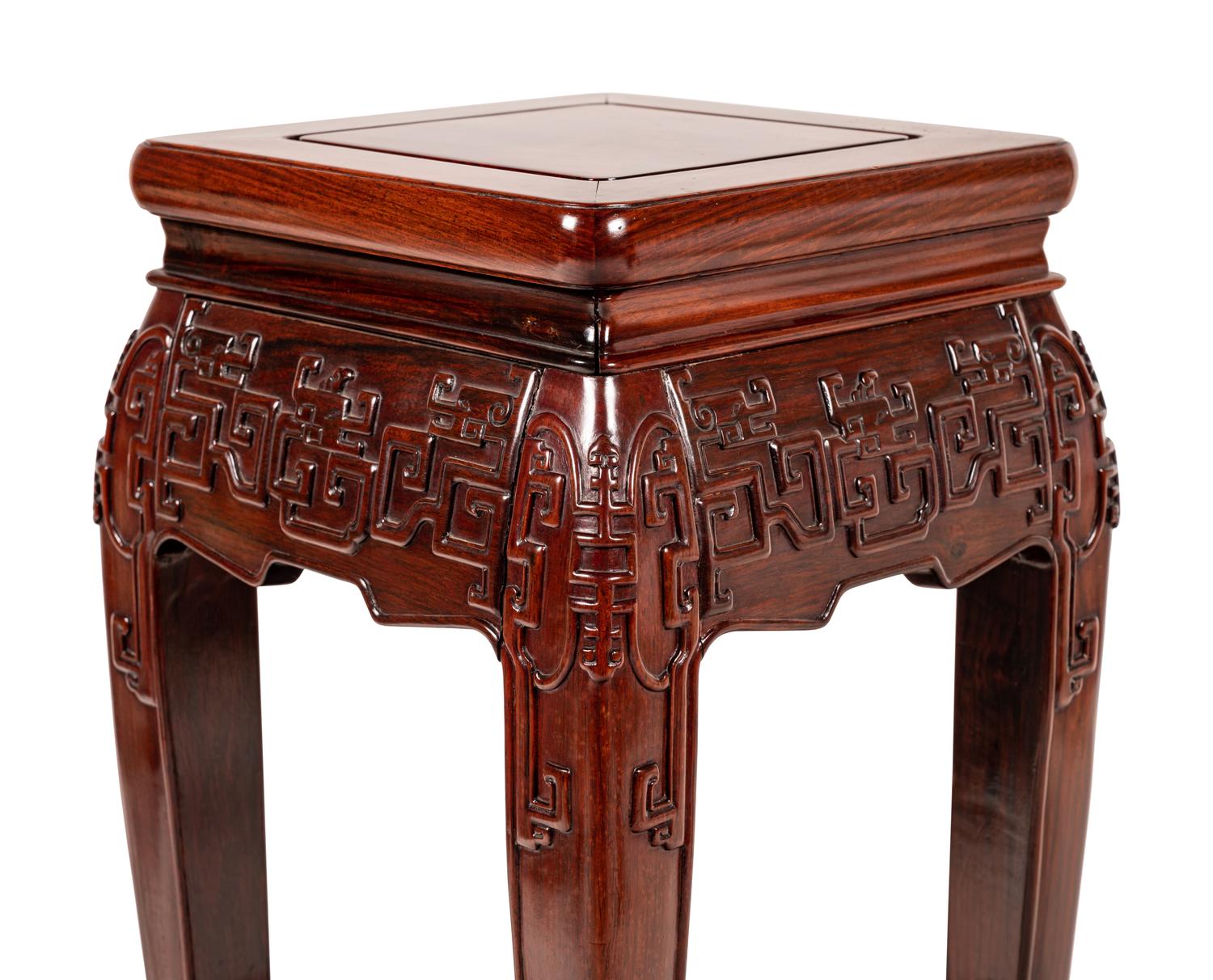 A Pair of Chinese Carved Hardwood Pedestals
