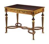 A Louis XVI Style Gilt Bronze Mounted Mahogany Writing Table