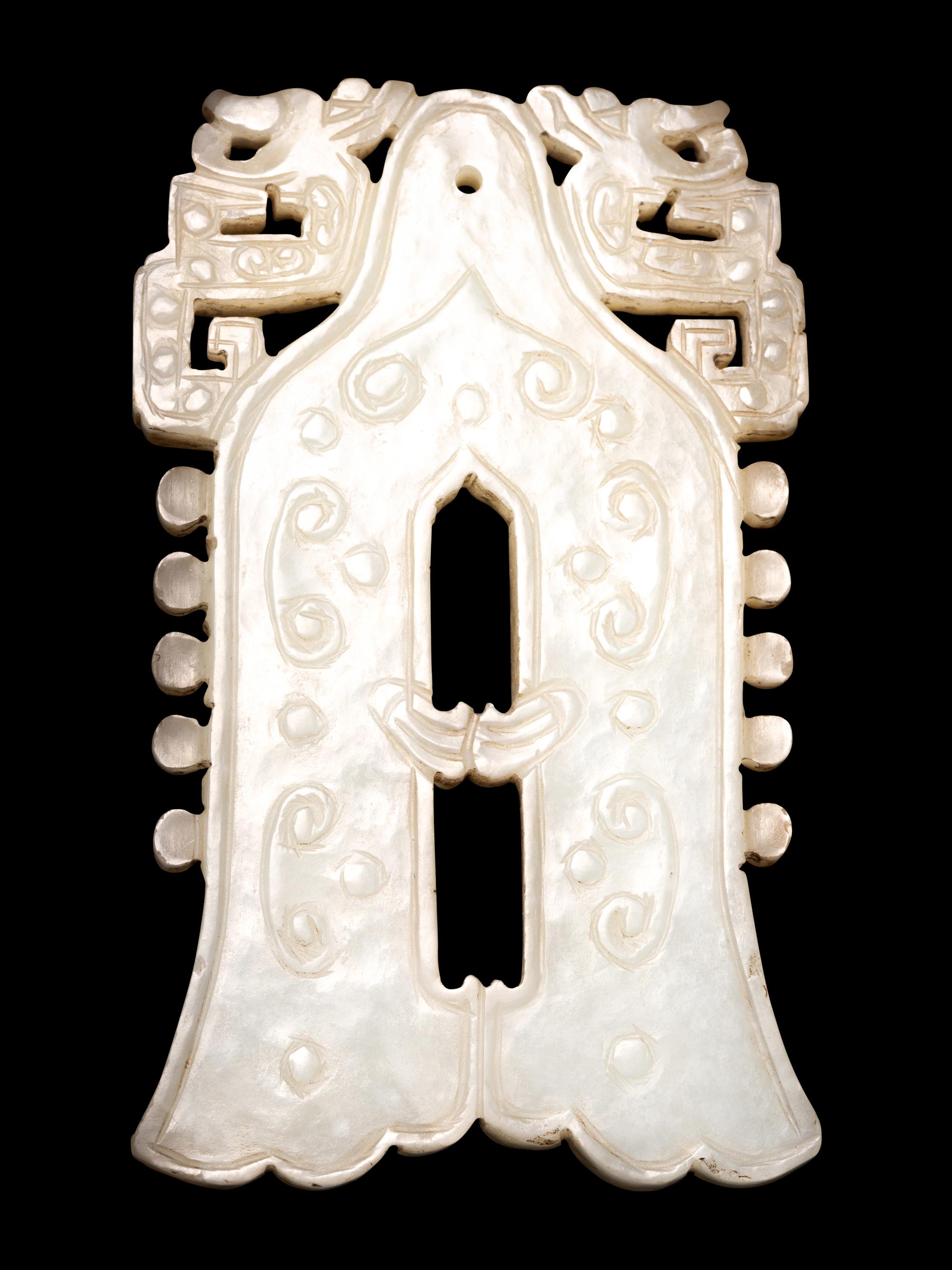 A Celadon Jade Bell-Form Pendant
