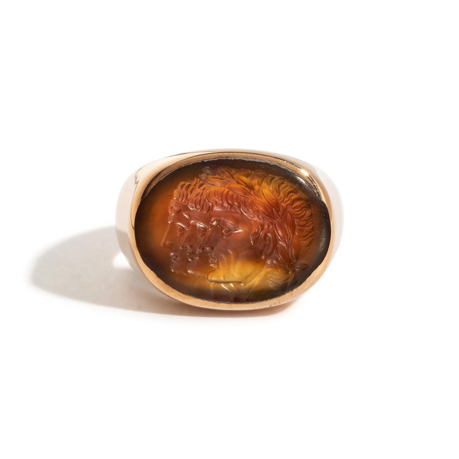 A Neoclassical Carnelian and Gold Finger Ring with a Roman Triumvir