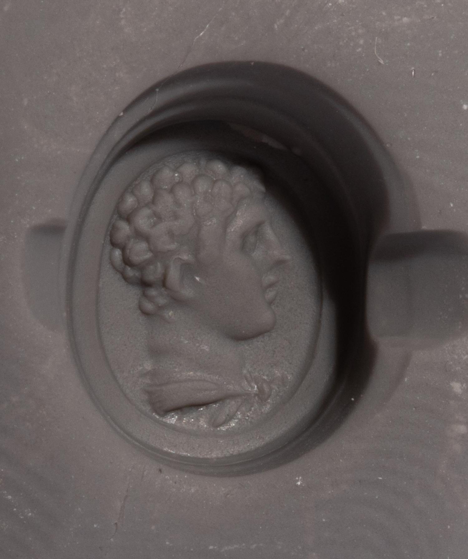 A Roman Carnelian Ring Stone with the Portrait Head of a Young Hercules — Set in a gold ring