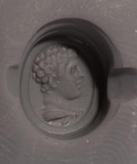 A Roman Carnelian Ring Stone with the Portrait Head of a Young Hercules — Set in a gold ring