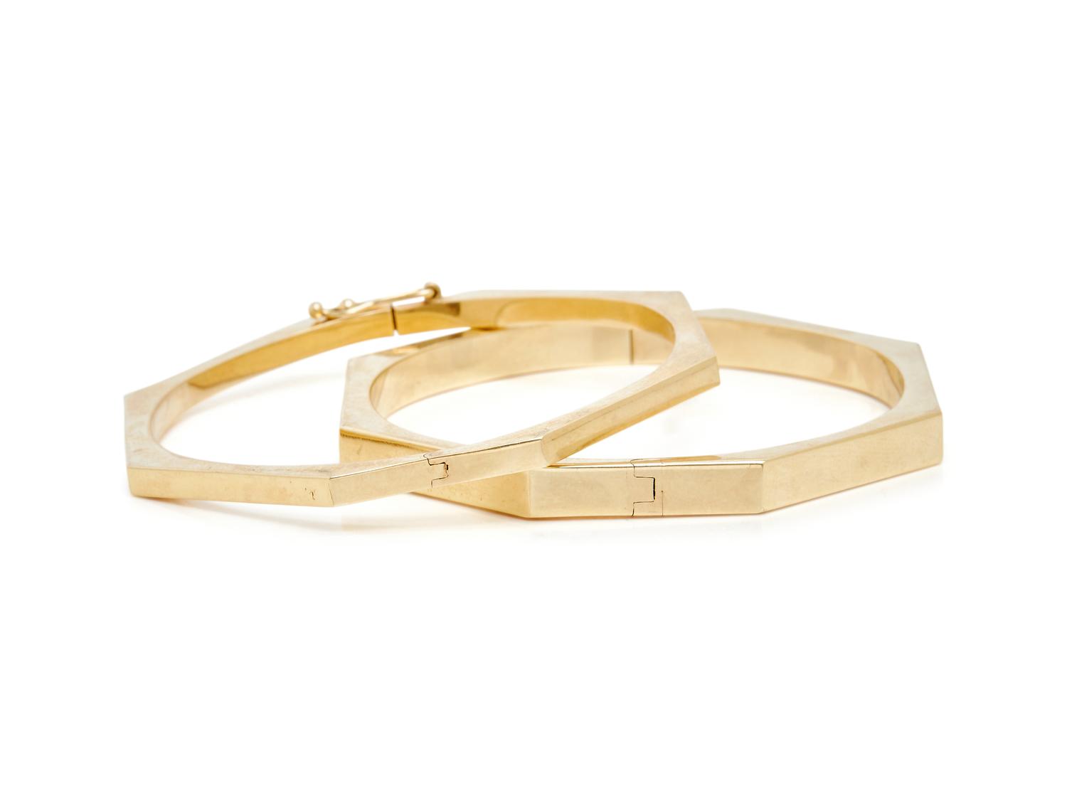 THREE YELLOW GOLD BANGLE BRACELETS