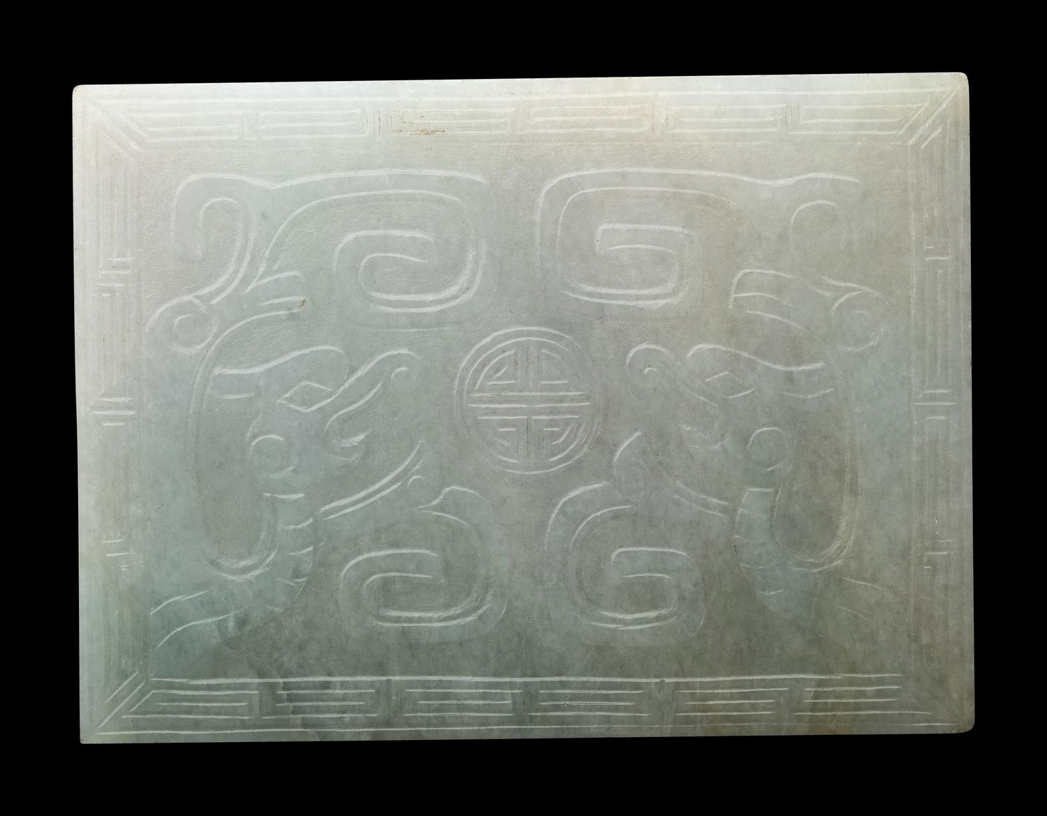 Three Chinese Apple Green and White Jadeite Buckles, 19th-20th Century 清晚期 翡翠帶扣三件