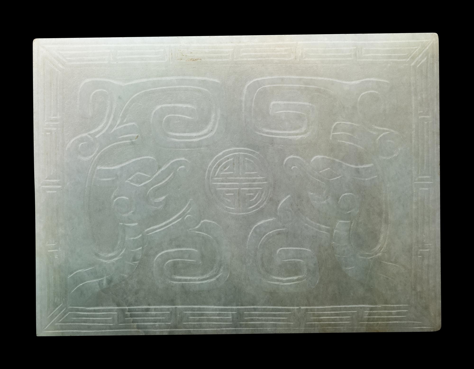 Three Chinese Apple Green and White Jadeite Buckles, 19th-20th Century 清晚期 翡翠帶扣三件