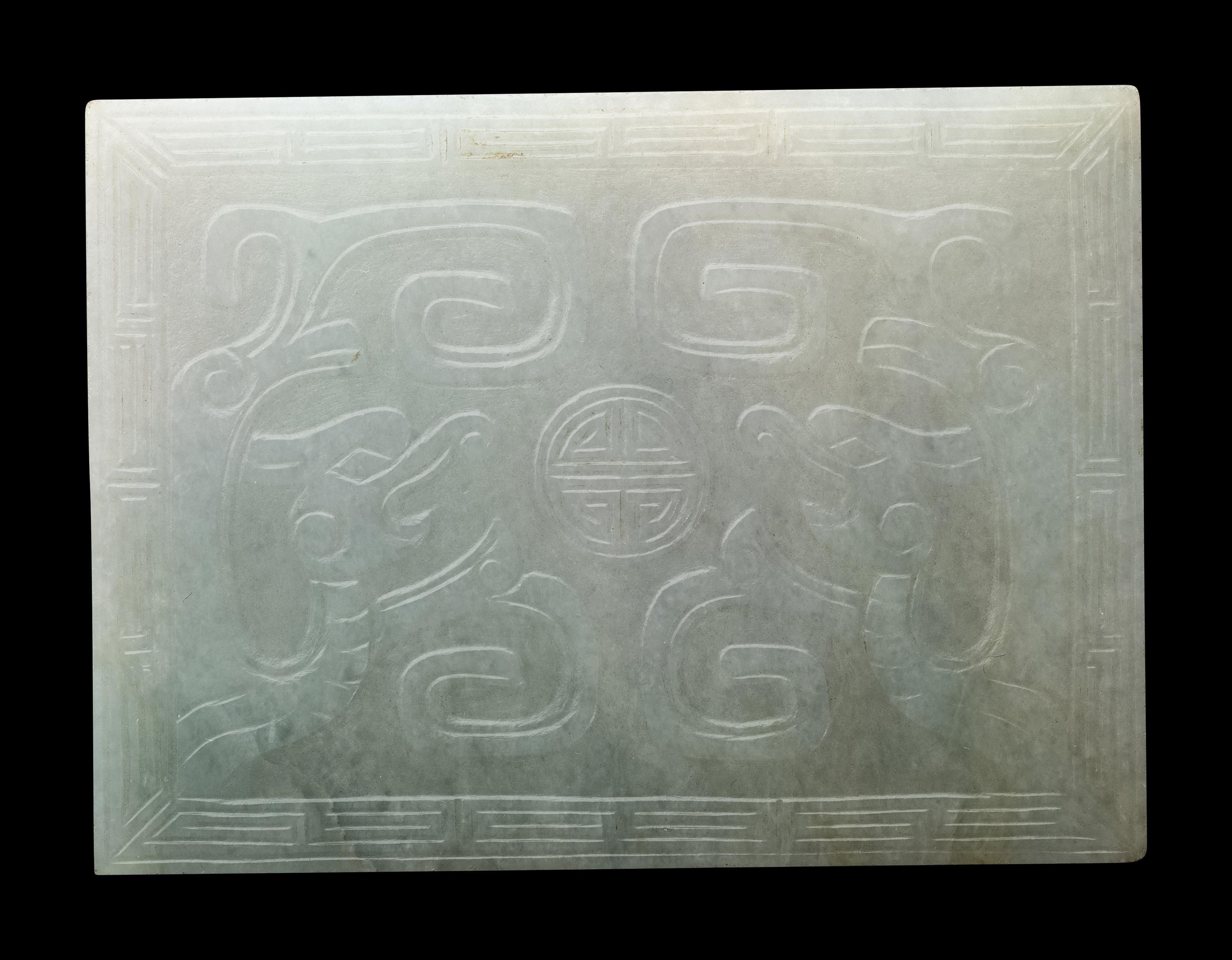 Three Chinese Apple Green and White Jadeite Buckles, 19th-20th Century 清晚期 翡翠帶扣三件