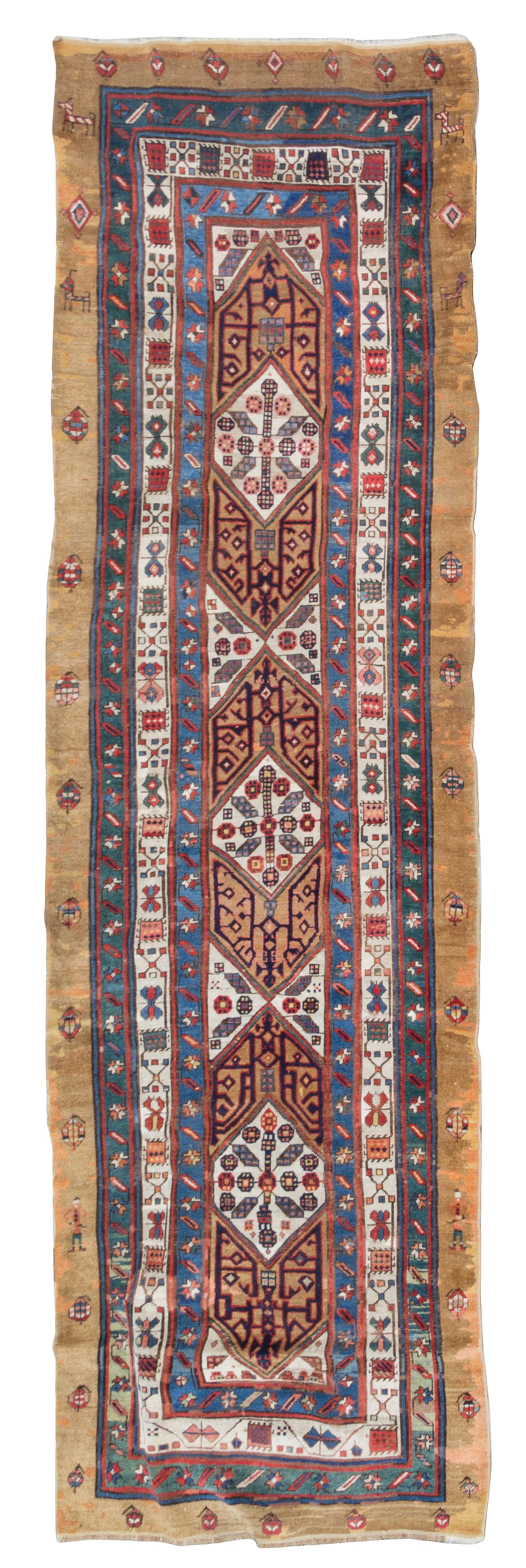 A Caucasian Wool Runner 11 feet 4 inches x 3 feet 8 1/2 inches.
