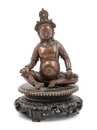 A Nepalese Bronze and Silver Figure of Seated Kubera