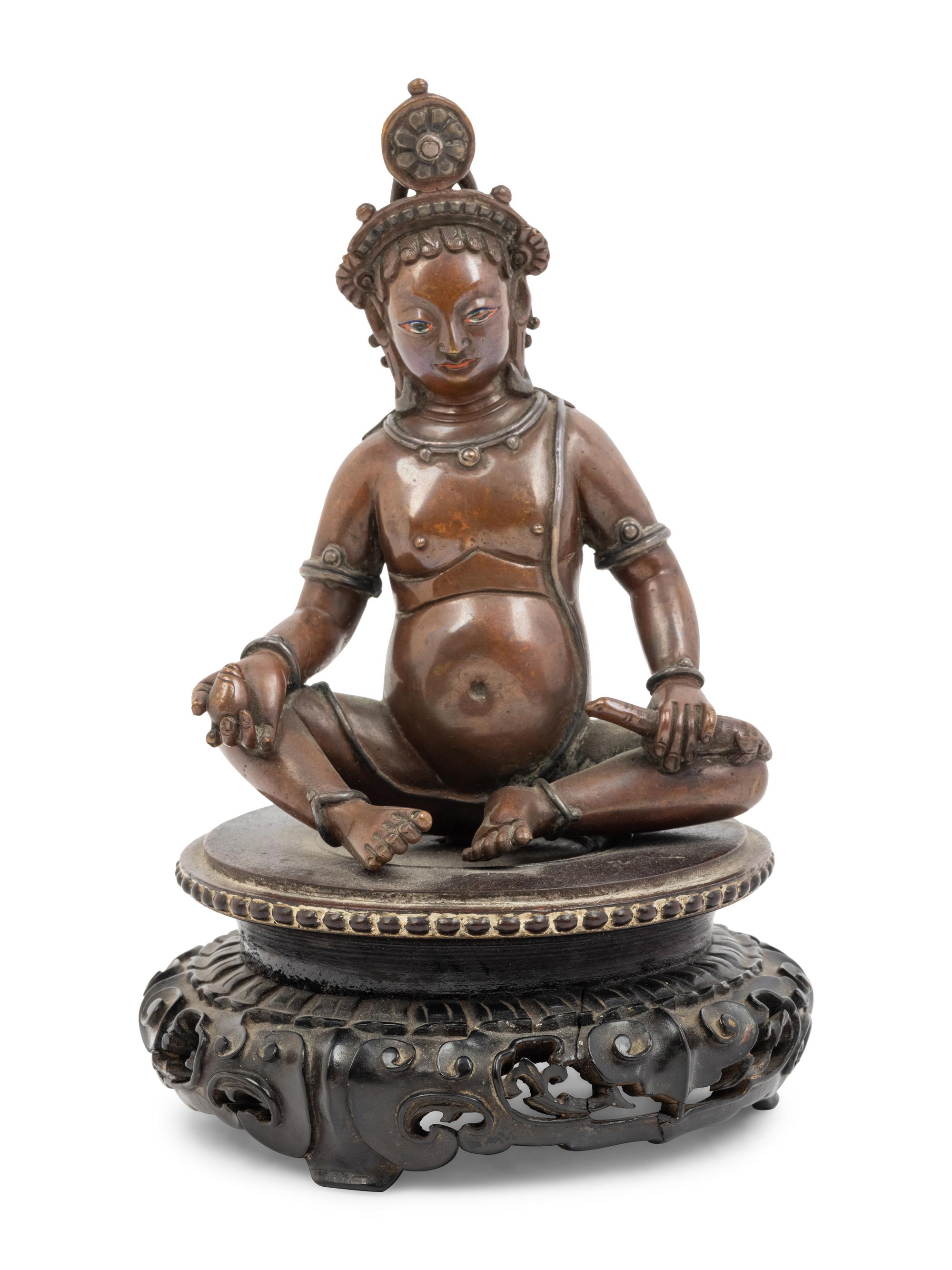 A Nepalese Bronze and Silver Figure of Seated Kubera