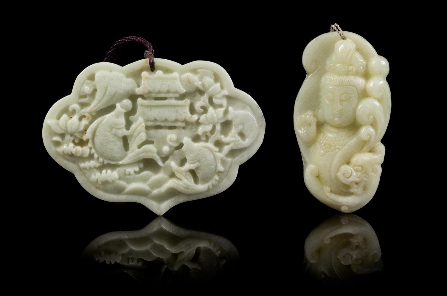 Two Carved Jade Pendants Width of first 3 5/8 inches.