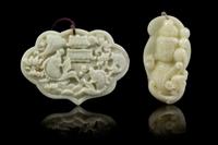 Two Carved Jade Pendants Width of first 3 5/8 inches.