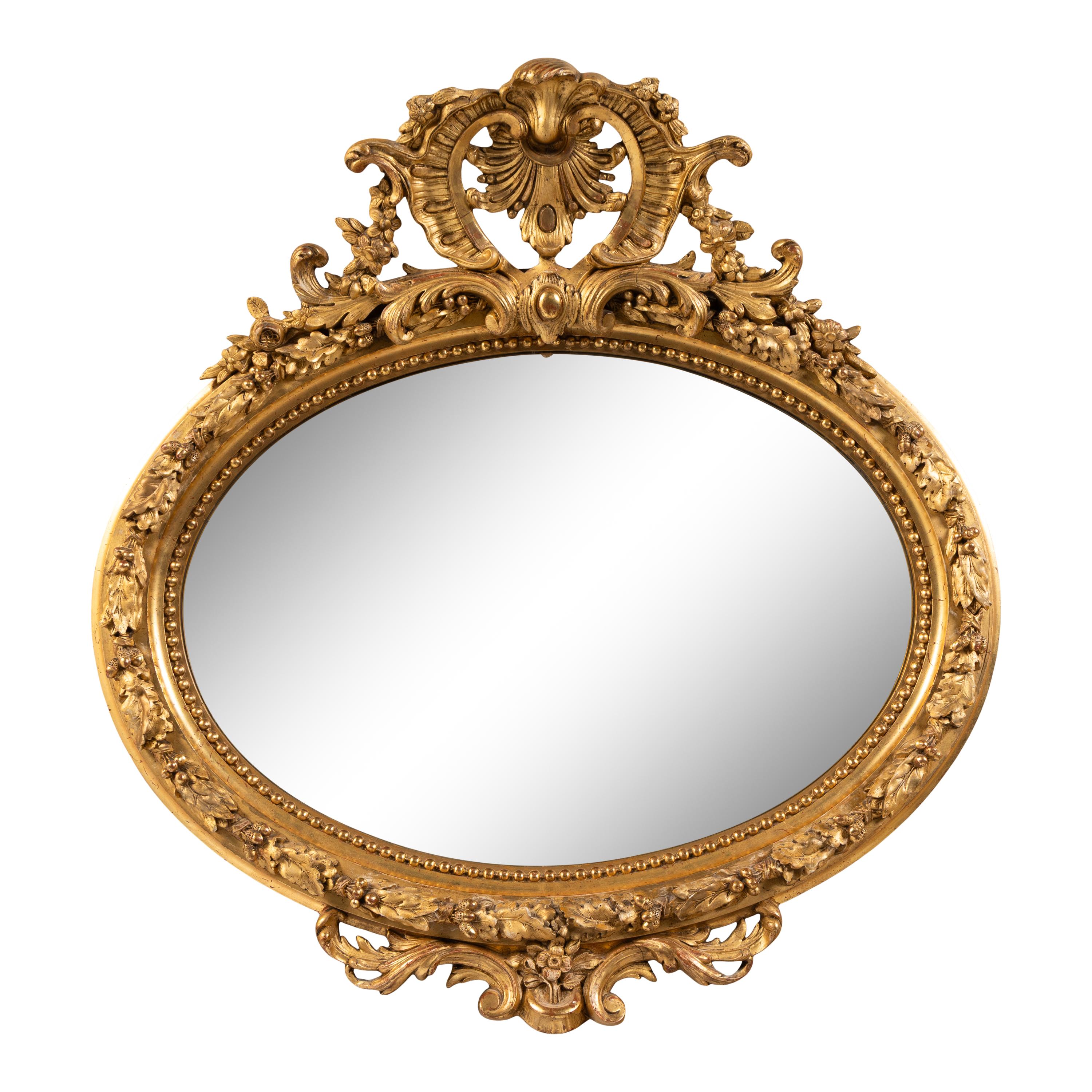 A French Giltwood and Composition Oval Mirror