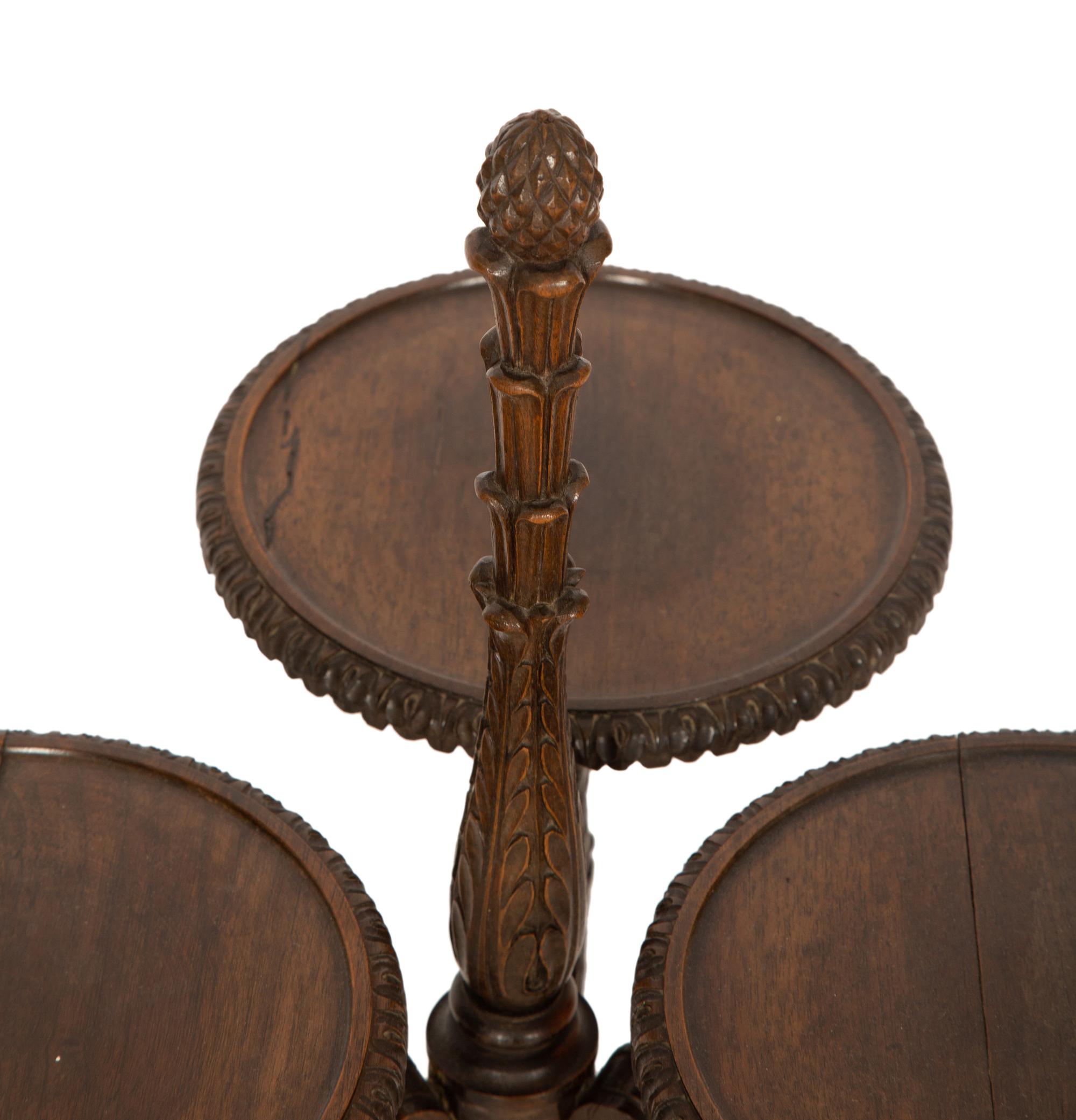 An Unusual English Carved Walnut Three-Part Stand
