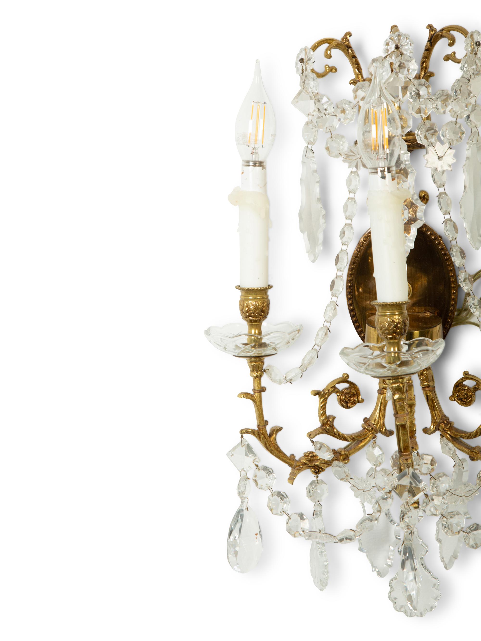 A Pair of Gilt Metal and Cut Glass Three-Light Wall Lights