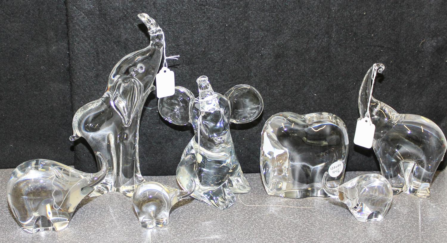A Collection of Seven Studio Glass Elephant Figures Height of tallest 10 3/8 inches.