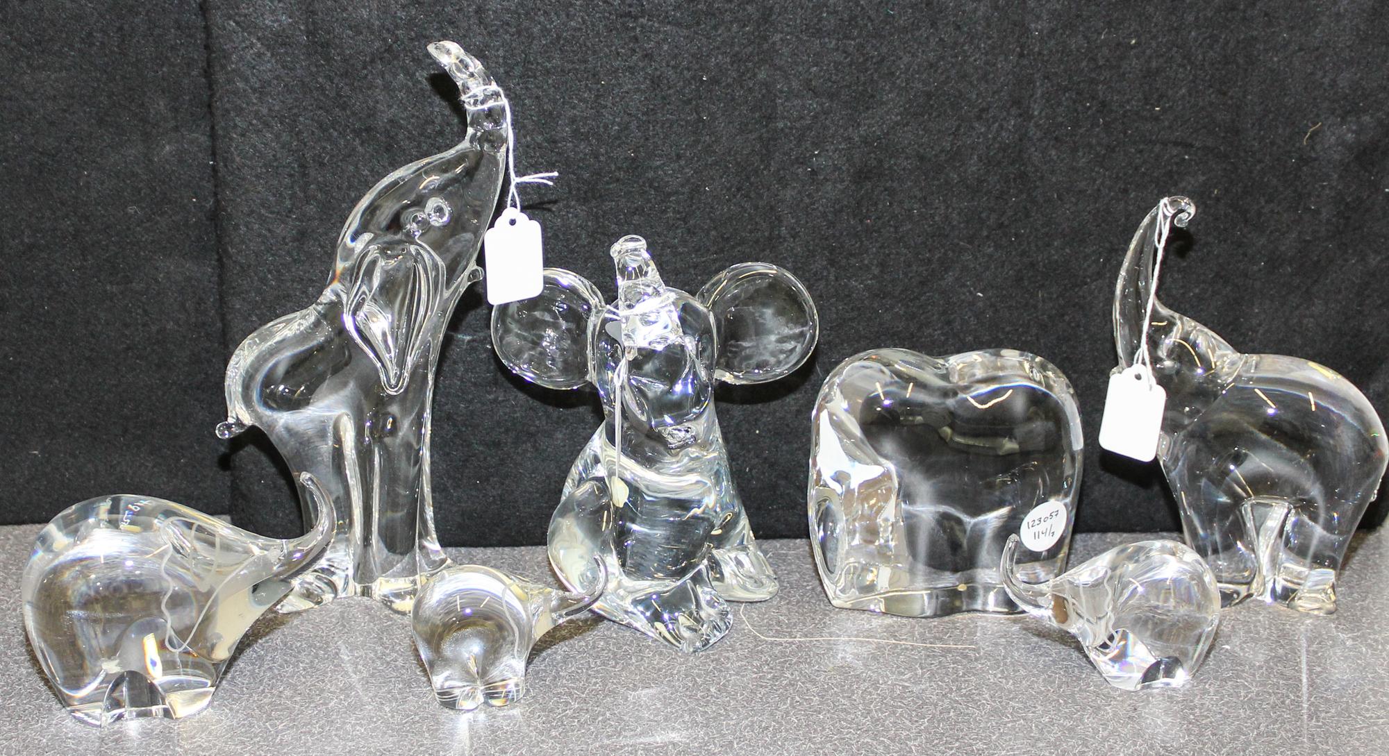 A Collection of Seven Studio Glass Elephant Figures Height of tallest 10 3/8 inches.