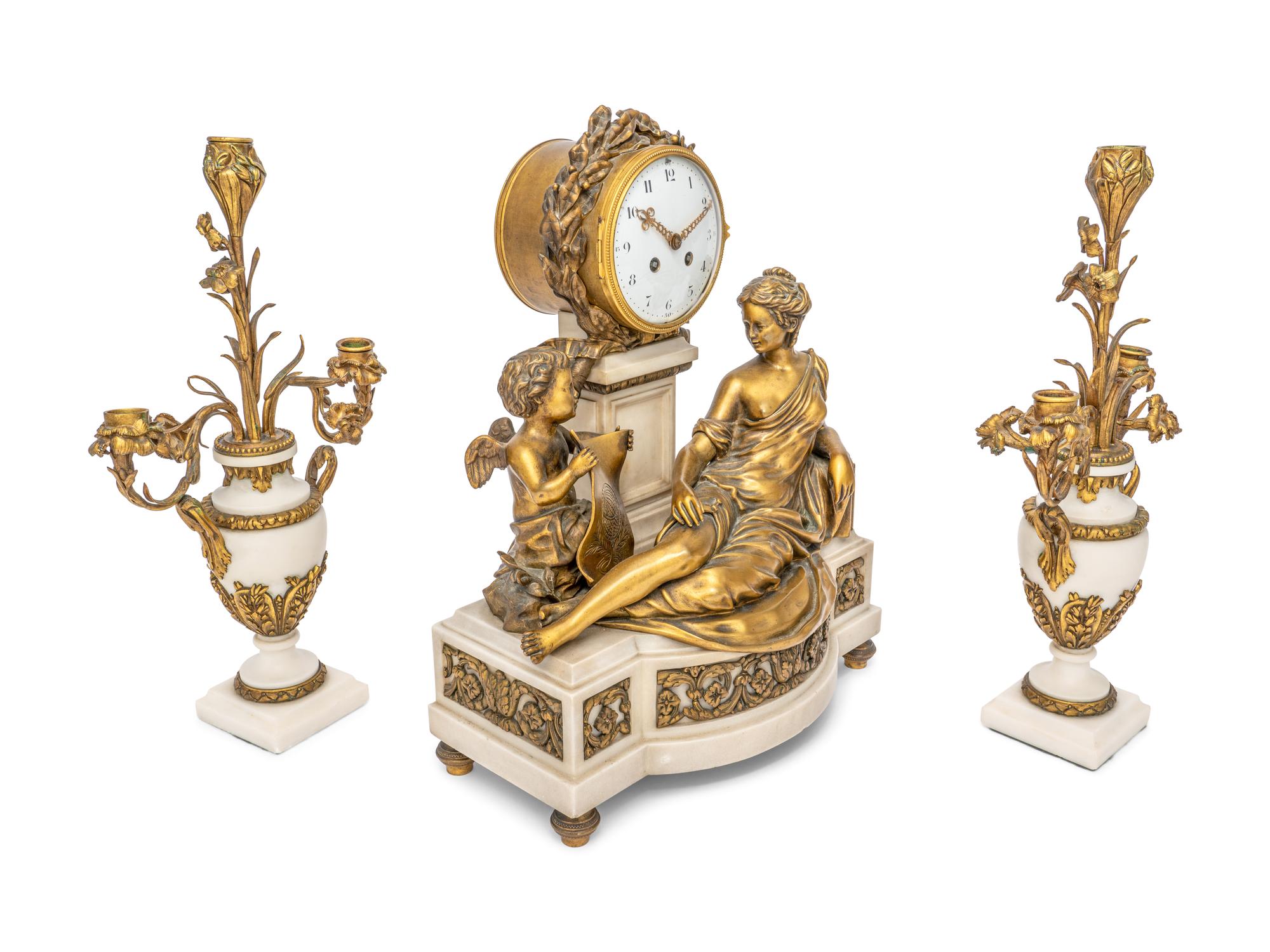 A French Gilt Bronze and Marble Clock Garniture
