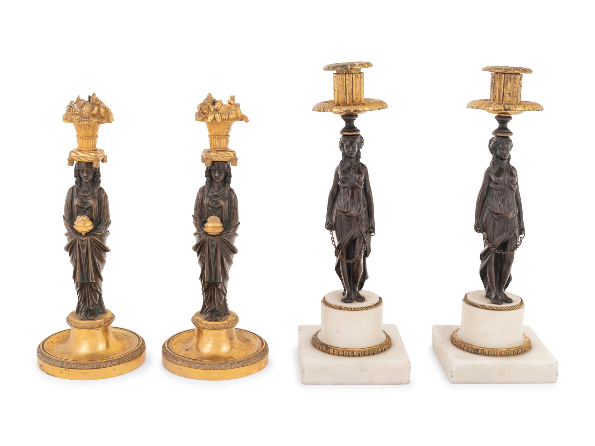 Two Pairs of French Gilt and Patinated Bronze Figural Candlesticks
