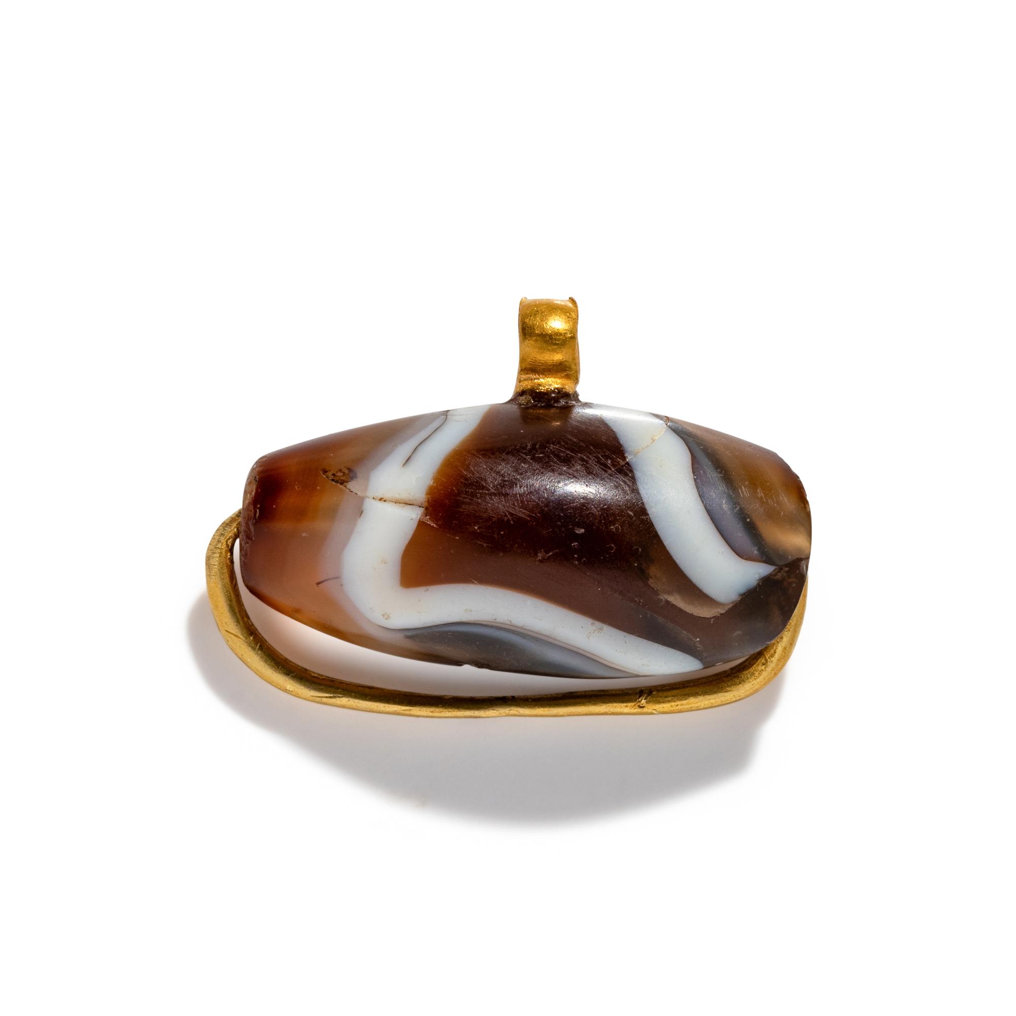 A Western Asiatic Gold and Agate Bead Pendant