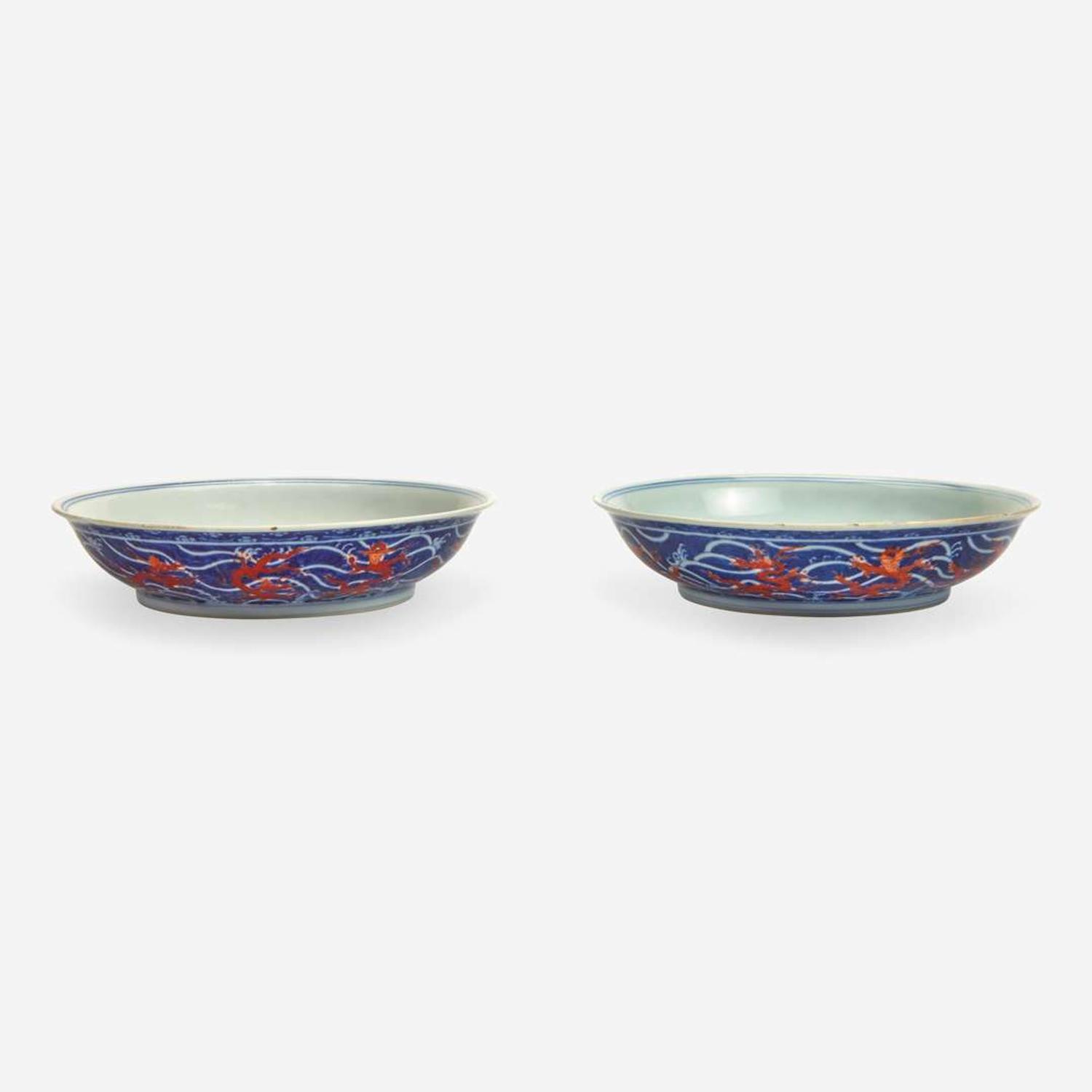 An associated pair of iron-red and underglaze blue "Dragon" Dishes 礬红青花龙纹盘子 或为一对 Qianlong six-character seal mark and of the period ????? ? ??
