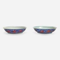An associated pair of iron-red and underglaze blue "Dragon" Dishes 礬红青花龙纹盘子 或为一对 Qianlong six-character seal mark and of the period ????? ? ??
