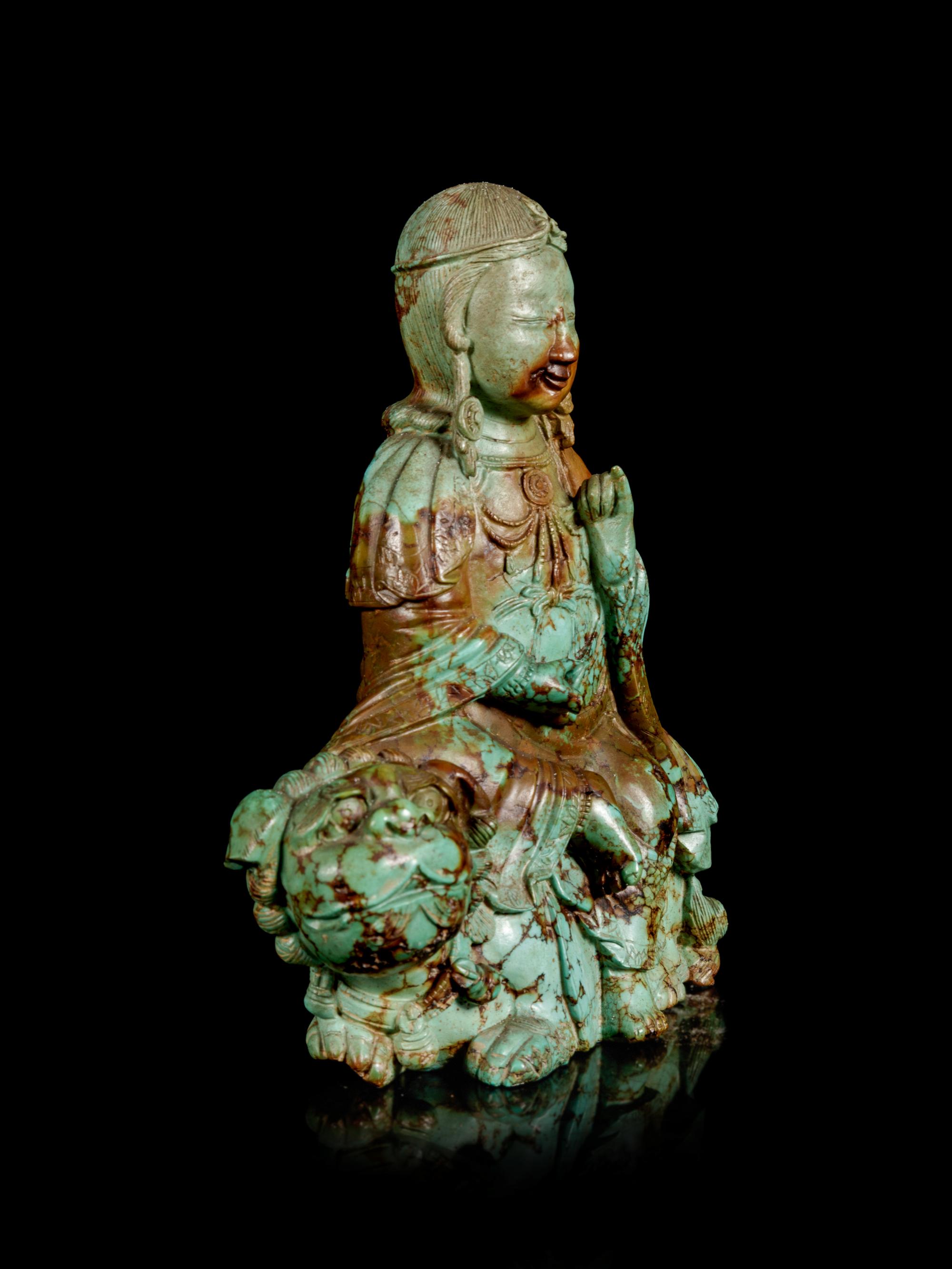 A Carved Turquoise Figure of Bodhisattva Manjushri
