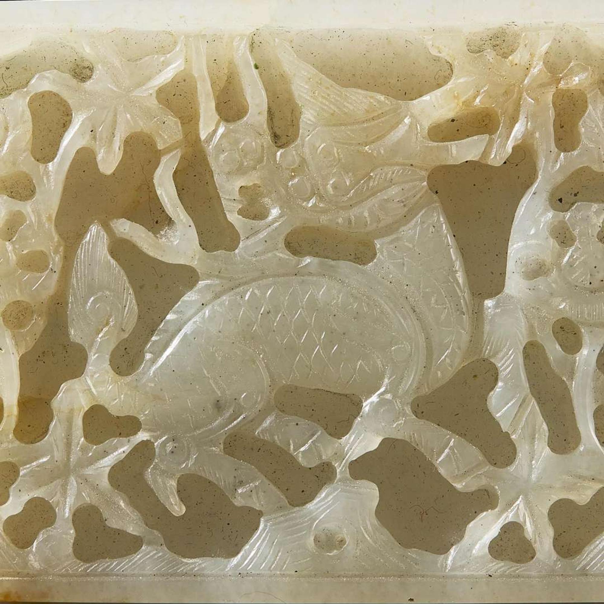 Two Chinese jade and jadeite thumb rings and a carved jade belt plaque 扳指及玉牌饰一组三件 Ming to Qing dynasty ???
