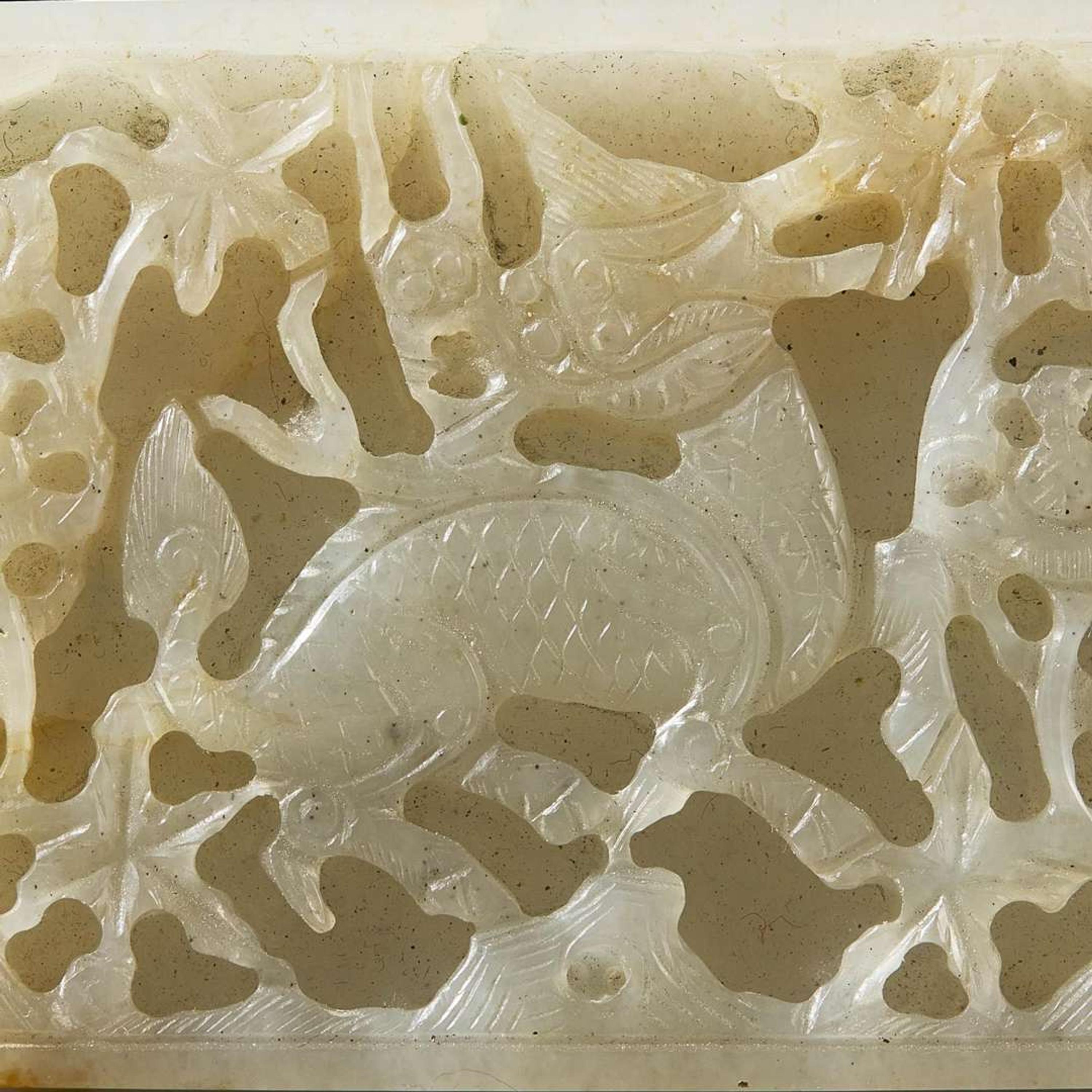 Two Chinese jade and jadeite thumb rings and a carved jade belt plaque 扳指及玉牌饰一组三件 Ming to Qing dynasty ???