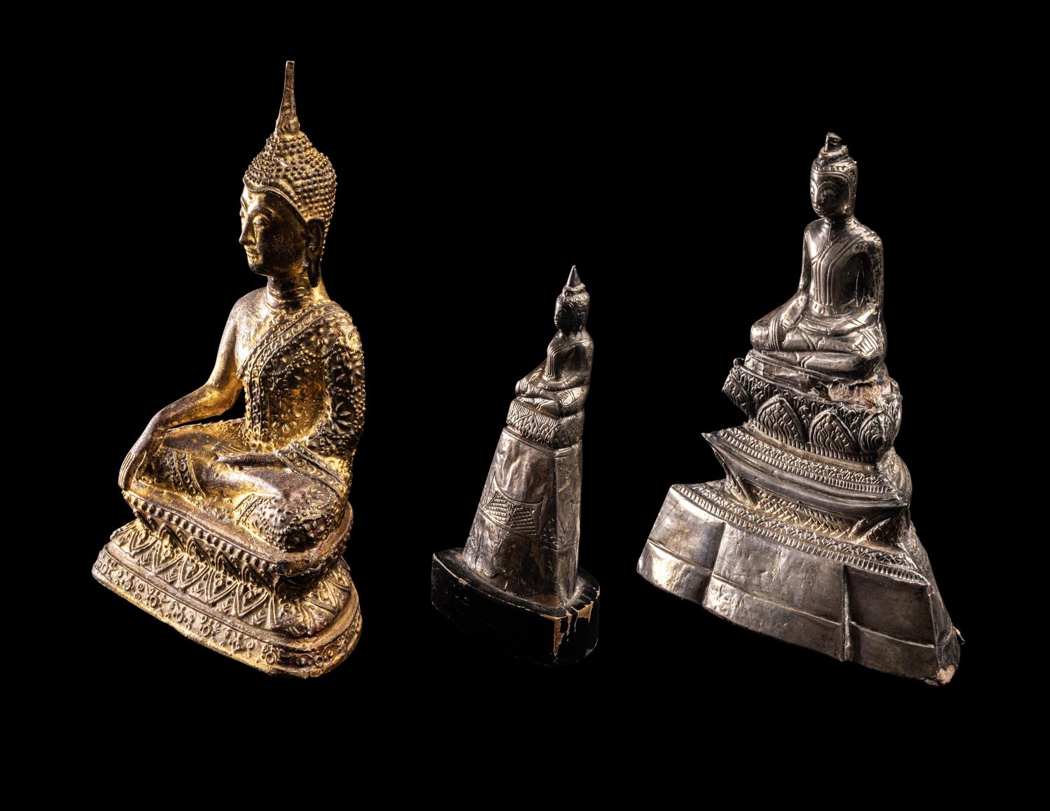 Three Thai Silver Veneered and Gilt Bronze Figures of Seated Buddha