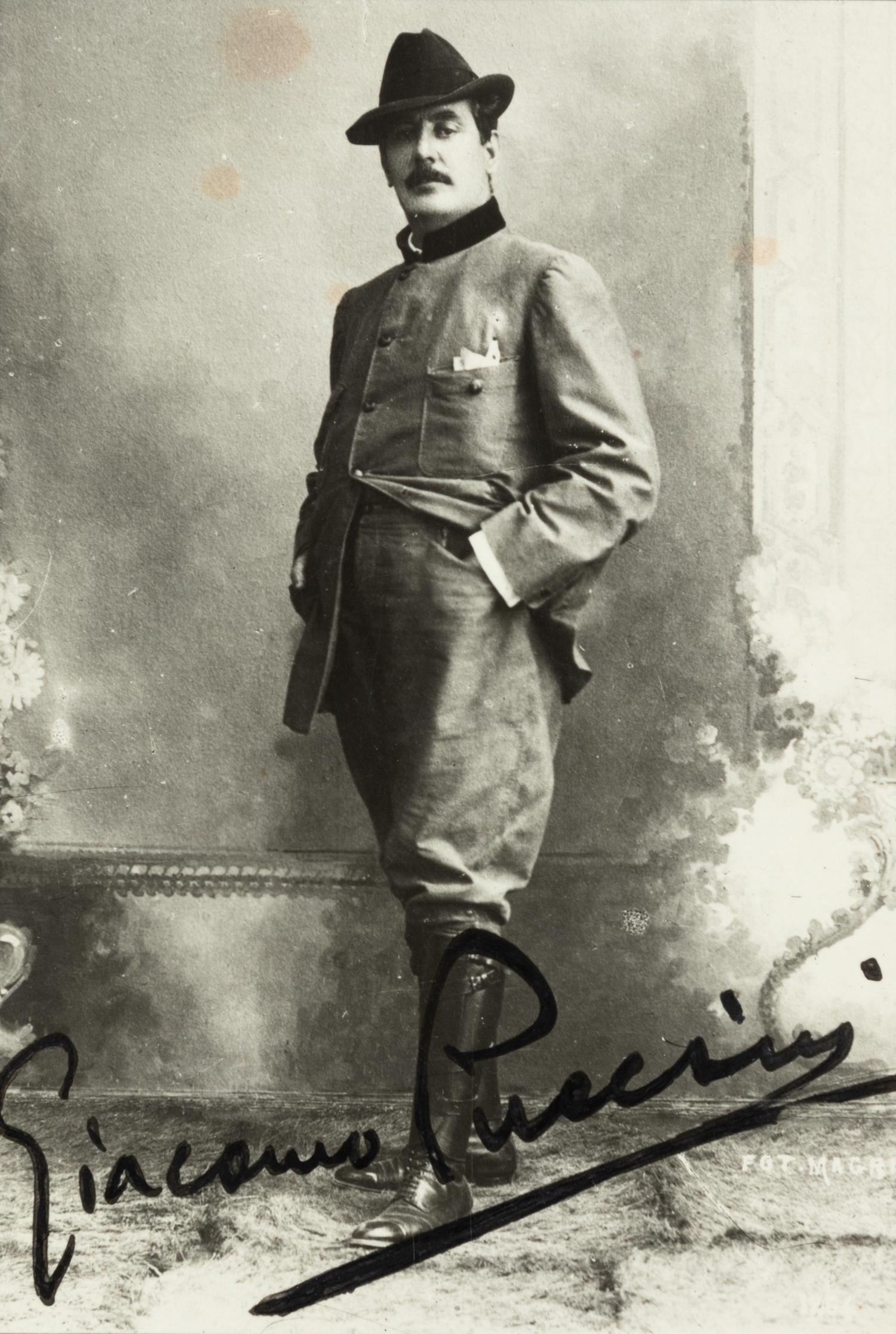 PUCCINI, Giacomo (1858-1924). Black and white photographic portrait, signed (“Giacomo Puccini”), n.d.