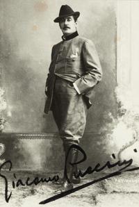 PUCCINI, Giacomo (1858-1924). Black and white photographic portrait, signed (“Giacomo Puccini”), n.d.