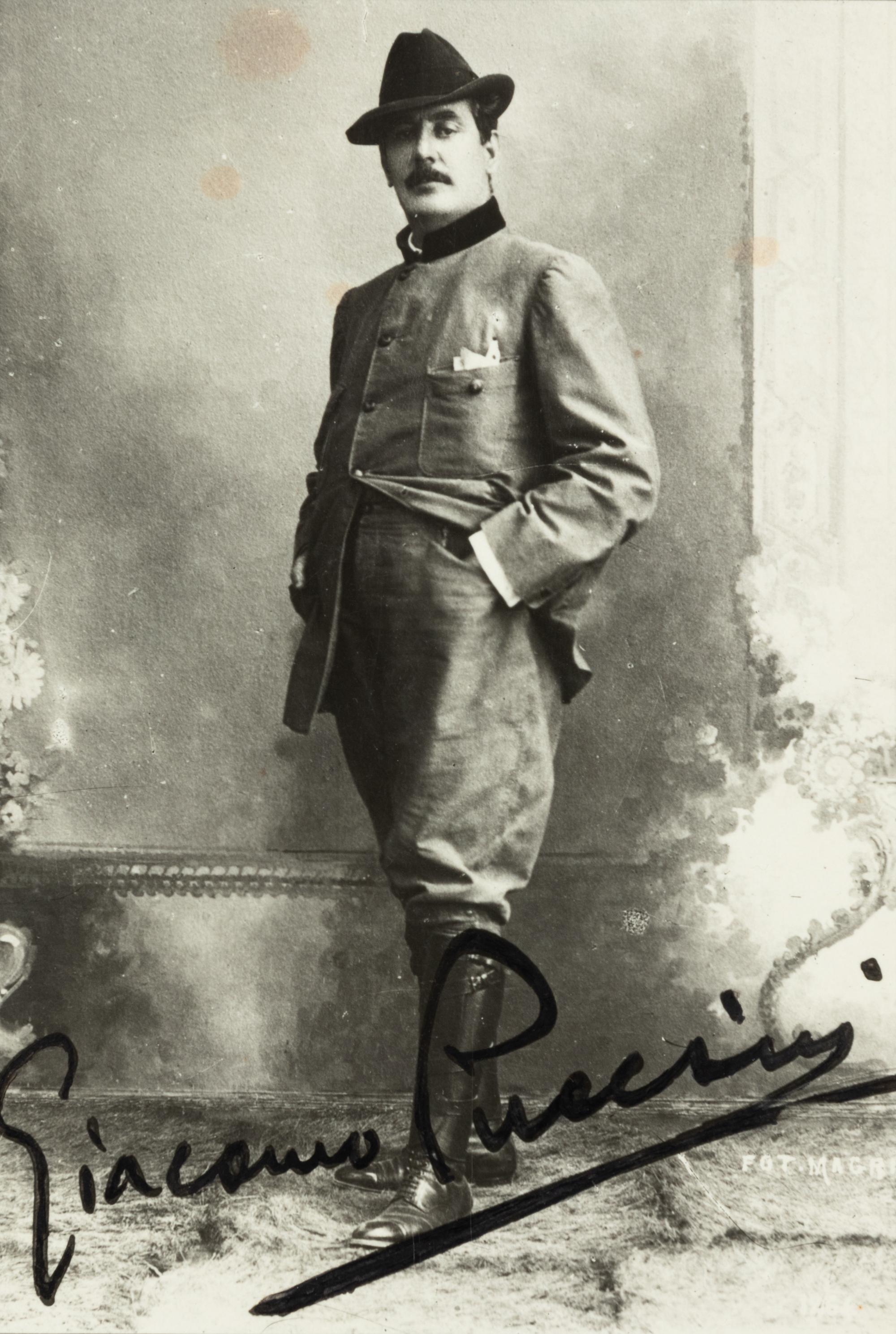 PUCCINI, Giacomo (1858-1924). Black and white photographic portrait, signed (“Giacomo Puccini”), n.d.