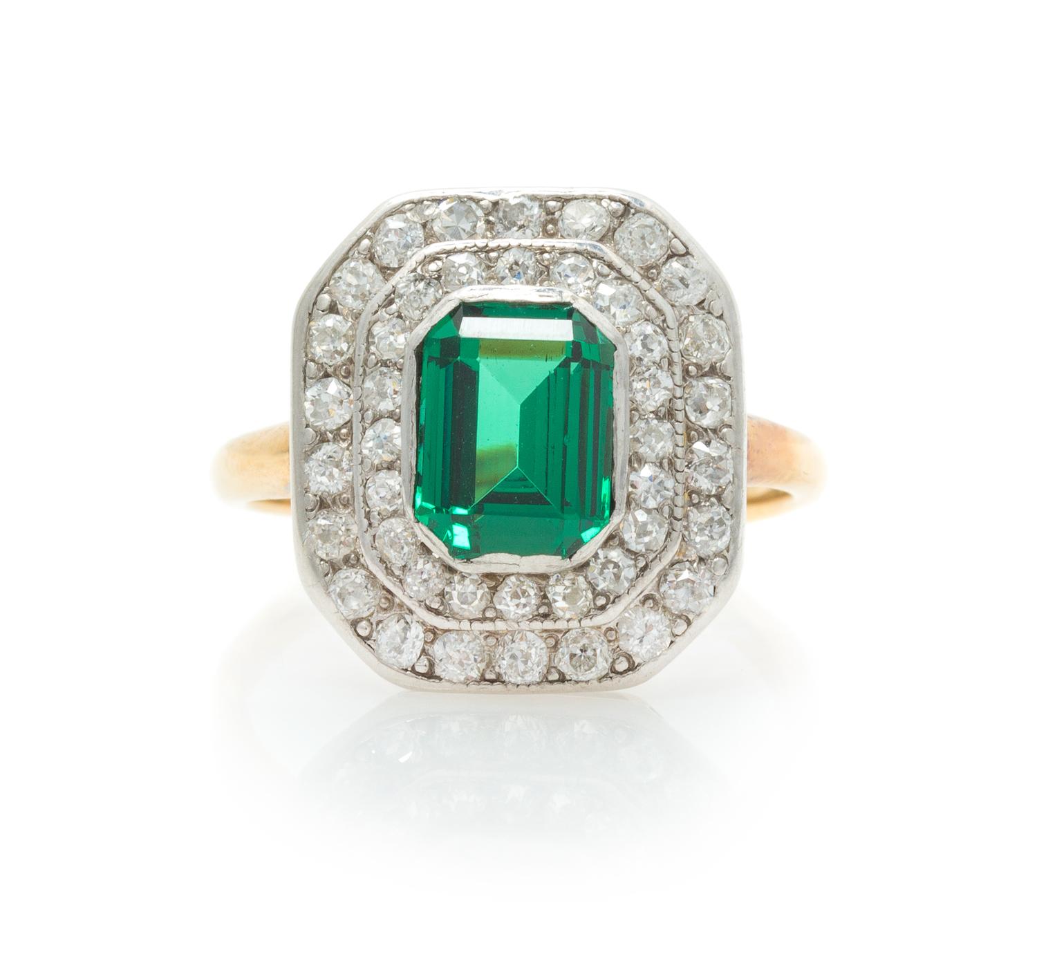 A Platinum Topped Rose Gold, Tsavorite Garnet and Diamond Ring, 3.80 dwts.