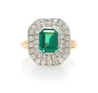 A Platinum Topped Rose Gold, Tsavorite Garnet and Diamond Ring, 3.80 dwts.