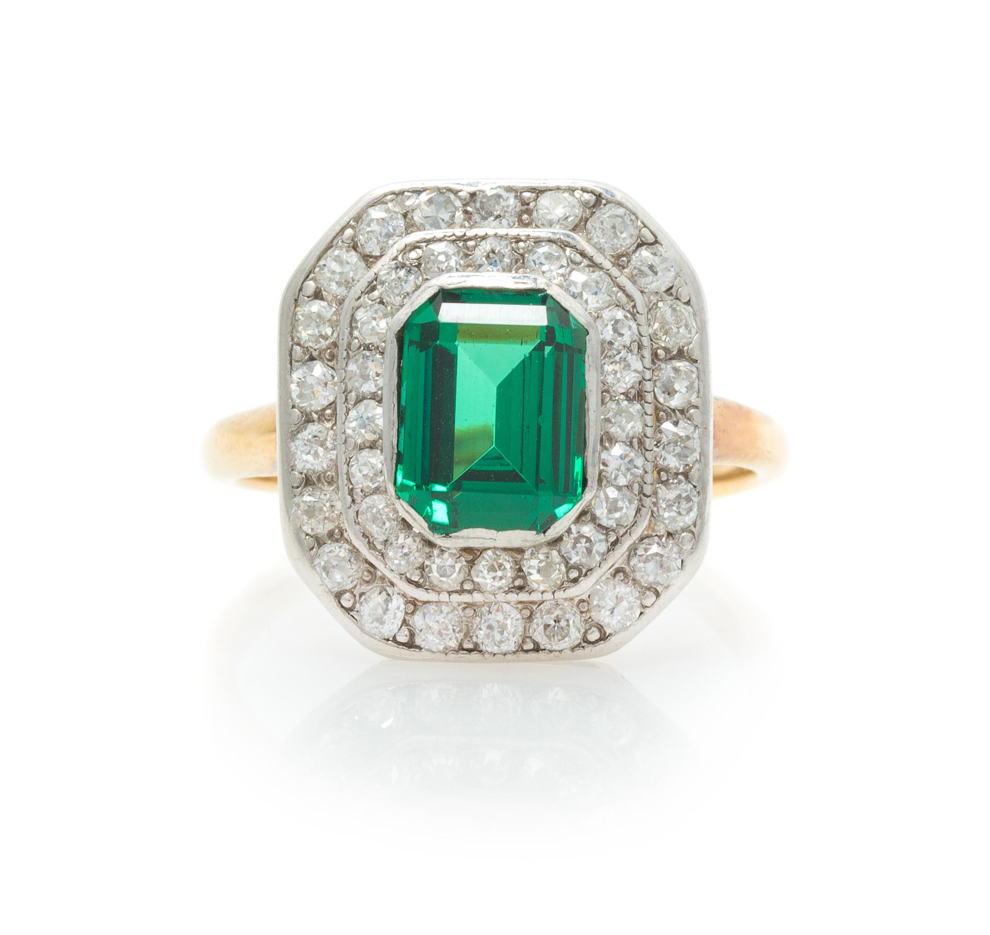 A Platinum Topped Rose Gold, Tsavorite Garnet and Diamond Ring, 3.80 dwts.