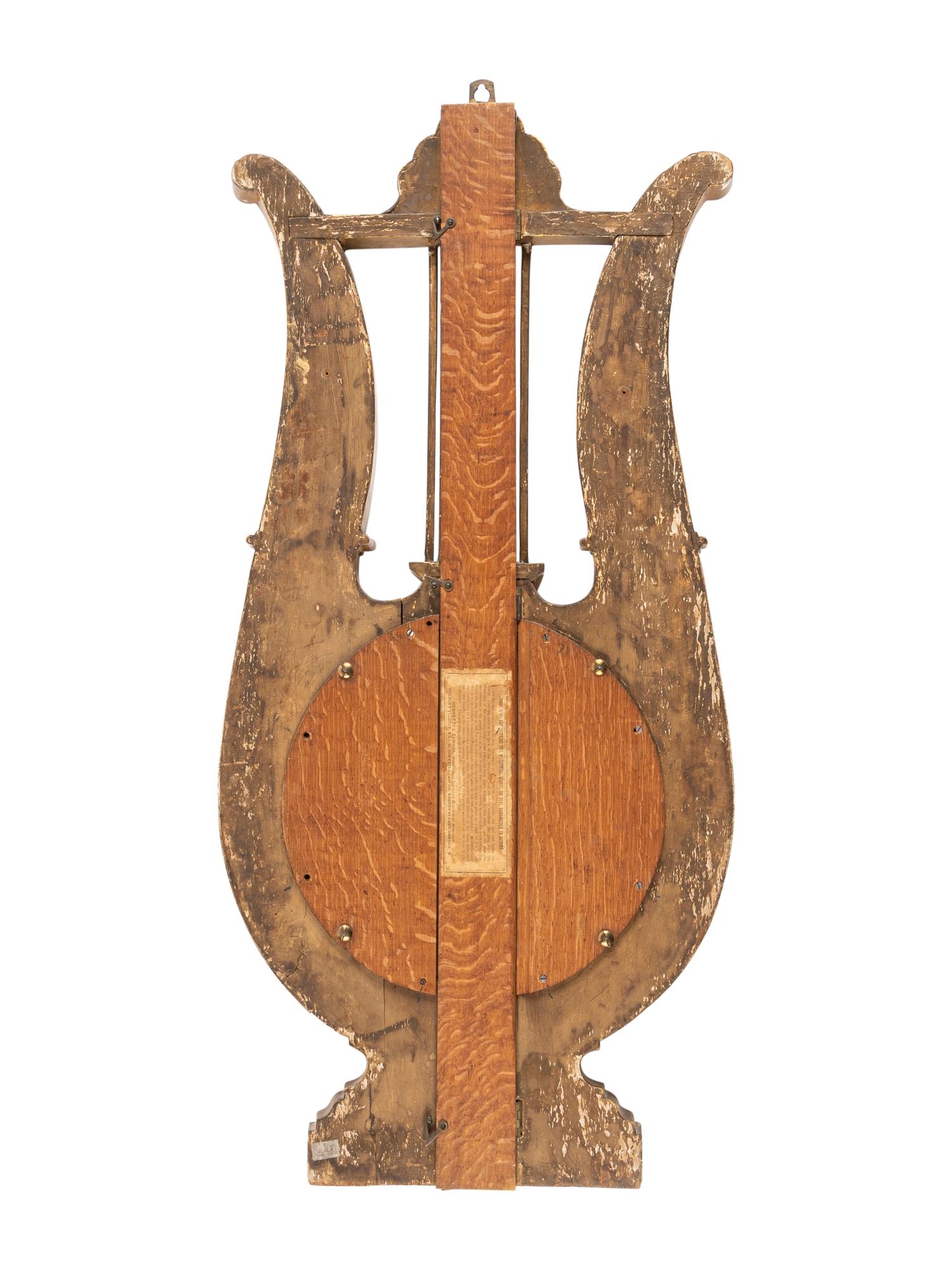 An Empire Giltwood and Reverse-Painted Glass Barometer